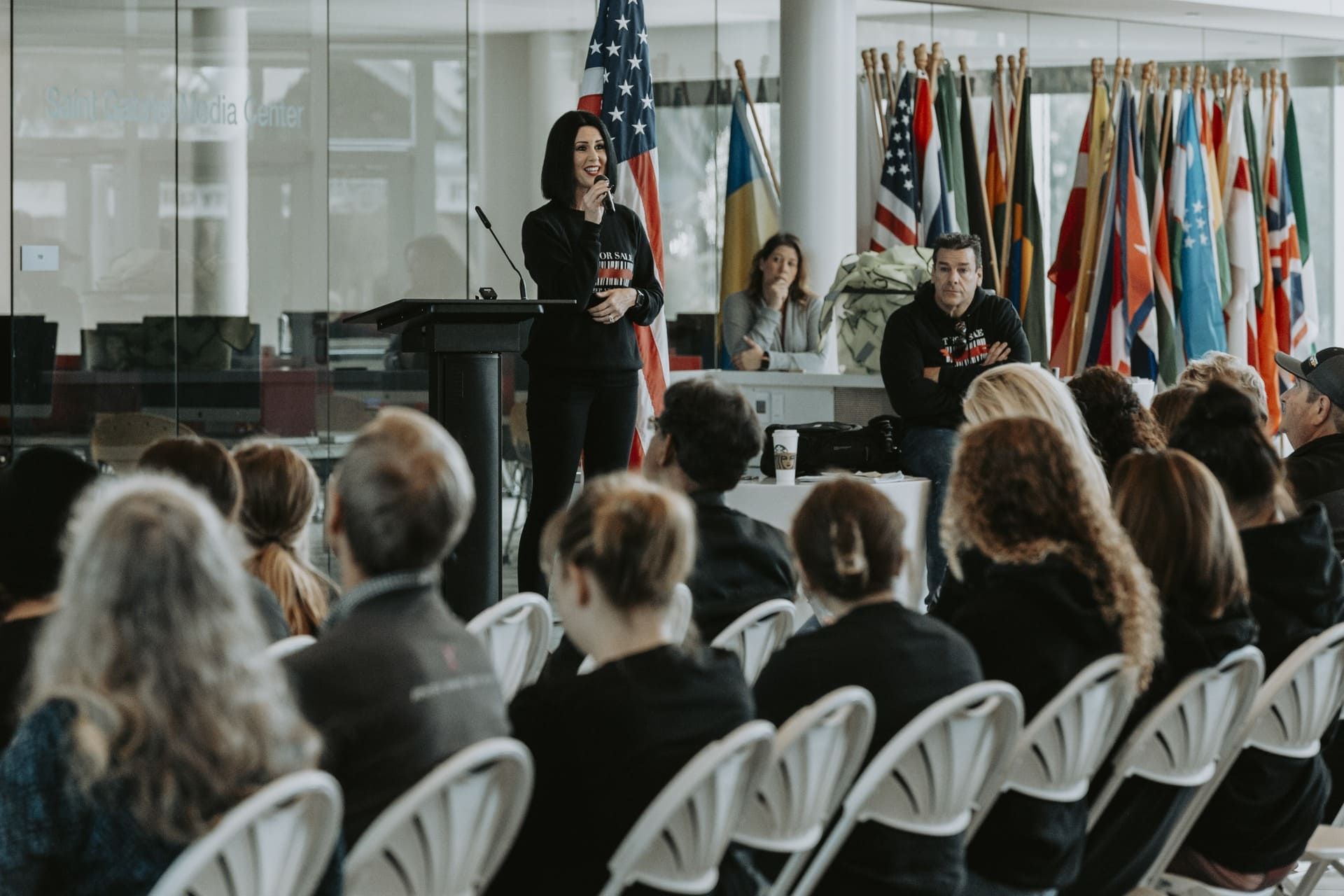 Kathie Grey speaking to a community audience during a human trafficking awareness and prevention presentation.